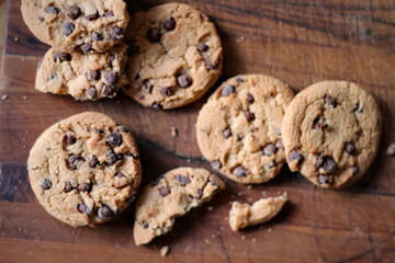 Delicious chocolate cookies placed on a wooden table