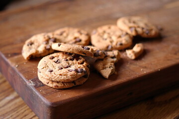 Delicious chocolate cookies placed on a wooden table