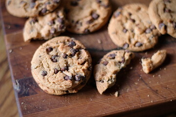 Delicious chocolate cookies placed on a wooden table