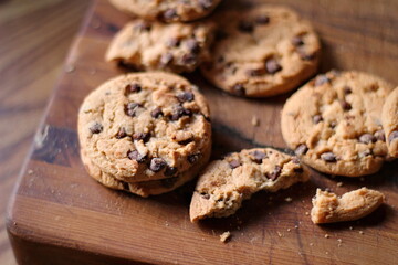Delicious chocolate cookies placed on a wooden table