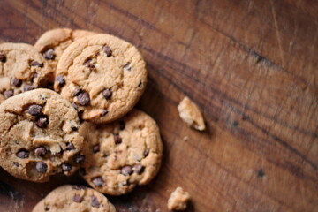 Delicious chocolate cookies placed on a wooden table