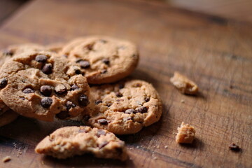 Delicious chocolate cookies placed on a wooden table