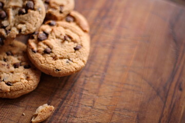 Delicious chocolate cookies placed on a wooden table