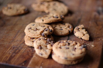 Delicious chocolate cookies placed on a wooden table