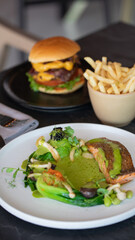 Female hands holding juicy burger in hands