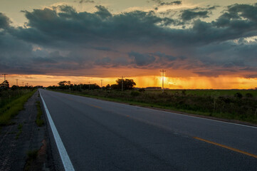 sunset on the road in santa vitória do palmar