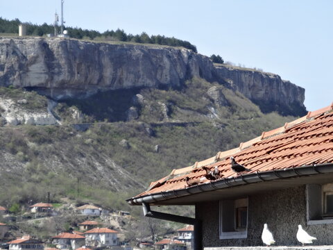 View of Ovech behind a House Roof in Provadia, Bulgaria