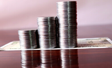 Closeup photo of coin,economic growth,success pillars,salary growth,saving and investing ,financial...