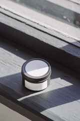 Black candle with white label