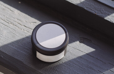 Black candle with white label