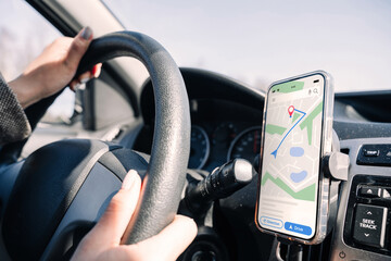 Gps device map system. Global positioning system on smartphone screen in auto car on travel road....