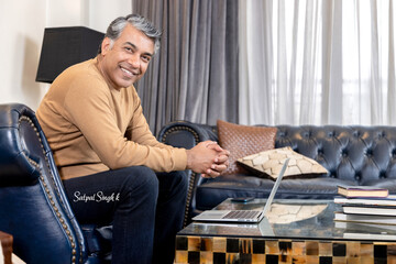 Fototapeta premium Businessman using laptop at home