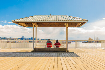 Couple relax by the sea and blue sky in the background. Beach resort Tropical pergola. Travel and vacation.