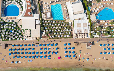 beach line and recreation area of hotels on the Mediterranean Sea in Protaras, Cyprus, view from the top, aerial