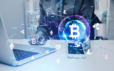 Businesswoman in formal wear holding smartphone and working on laptop