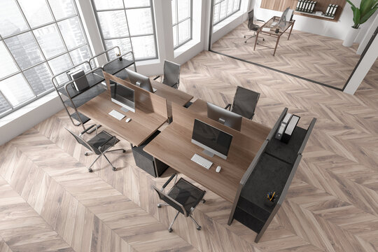 Top view on bright office interior with tables with desktops