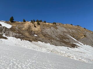 Rocky peak Chrutlenstogg (1966 m) with the stone cliff Chrutlenwand in the Glarus Alps mountain...