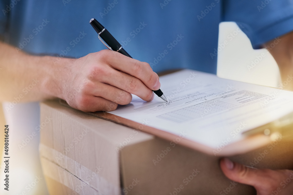 Sticker Keeping the paper trail intact. Shot of an unidentifiable delivery man filling in paperwork while out on a delivery.