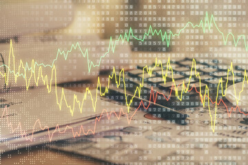 Double exposure of financial chart drawings and desk with open notebook background. Concept of forex market