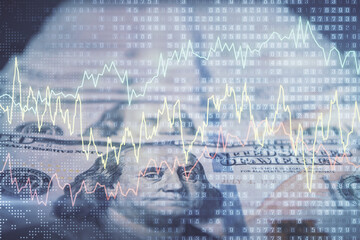 Double exposure of forex graph drawing over us dollars bill background. Concept of financial markets.