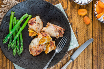 Chicken thighs with appricot stuffing and asparagus