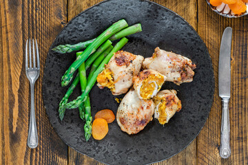 Chicken thighs with appricot stuffing and asparagus