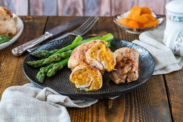 Chicken thighs with appricot stuffing and asparagus