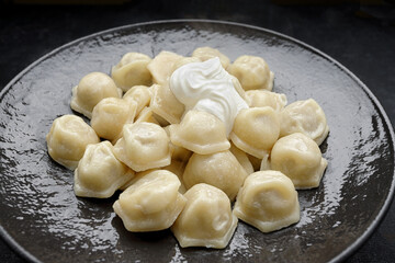 Ukrainian dumplings with sour cream