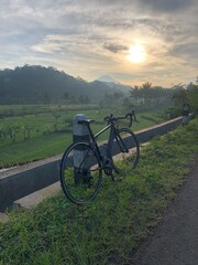 roadbike on the field with sunrise