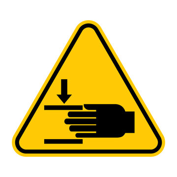 Crushing of hands sign. Vector illustration of yellow triangle warning sign with hand crush force from above icon inside. Safety symbol isolated on white background. Risk of hand injuries.
