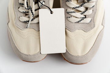 part of modern sneakers made of combined materials and colors with a high sole and a label with...