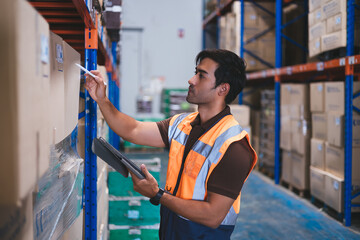 Smart engineer man worker wearing safety helmet doing stocktaking of product management in tablet box on shelves in warehouse. Factory physical inventory count. warehouse, Import Ecport export concept