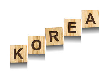 Korea, word on wooden blocks. Isolated on a white background.