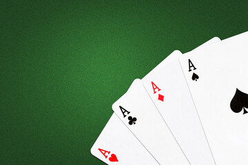 Four Aces on a green poker background.Copy Space. Gamble. Playing cards.