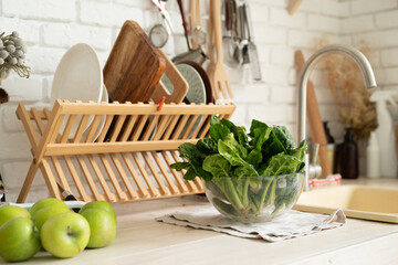 Washing spinach in the Kitchen Sink, copy space