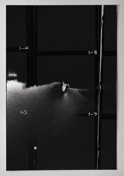 photo of black and white medium format hand copy contact sheet with empty frames and torn cutting hole. retro photo placeholder. analogue test strip.