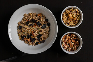 bowl of healthy breakfast with nuts 
