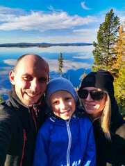 A family on the White Sea coast on a sunny day. Karelia. Russia. SEPTEMBER 2021