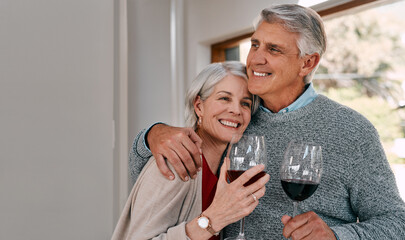 Nothing says romance like sharing some red wine. Shot of a happy mature couple having red wine...