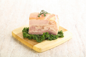 Cut of pork bacon over board