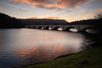 Fototapeta na wymiar Bridge on a Ladybower Reservoir in Peak District just before sunrise