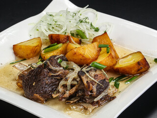Grilled beef with potato and onion