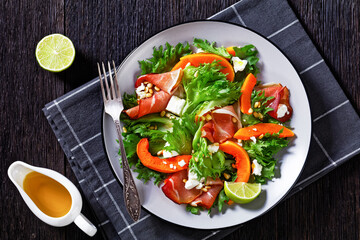 pumpkin salad with lettuce, crumbled cheese, ham