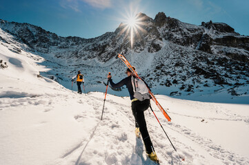 Mountaineer backcountry ski walking ski alpinist in the mountains. Ski touring in alpine landscape...