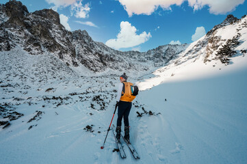 Mountaineer backcountry ski walking ski alpinist in the mountains. Ski touring in alpine landscape...
