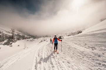 Mountaineer backcountry ski walking ski alpinist in the mountains. Ski touring in alpine landscape...