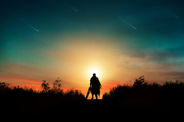 Fototapeta na wymiar Fantasy landscape. The swordsman is looking the view of comet on the sky.