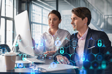 Businessman and businesswoman working together to protect clients confidential information and...