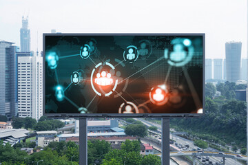 World planet Earth map hologram and social media icons on billboard over panorama city view of Kuala Lumpur, Malaysia, Asia. The concept of people networking and connections.