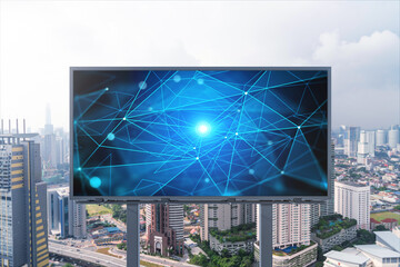 Technology hologram on billboard over panorama city view of Kuala Lumpur. KL is the largest tech hub in Malaysia, Asia. The concept of developing coding and high-tech science.